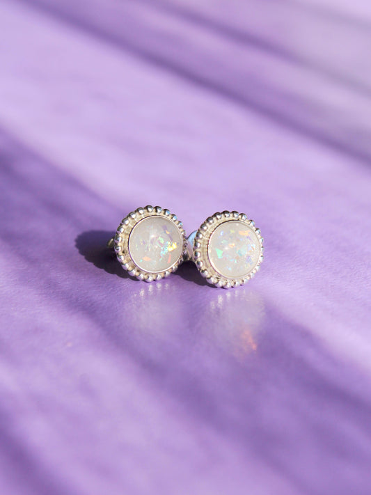 sterling silver breastmilk studs with opalescent flecks